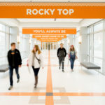 students walking down a hall at the student union
